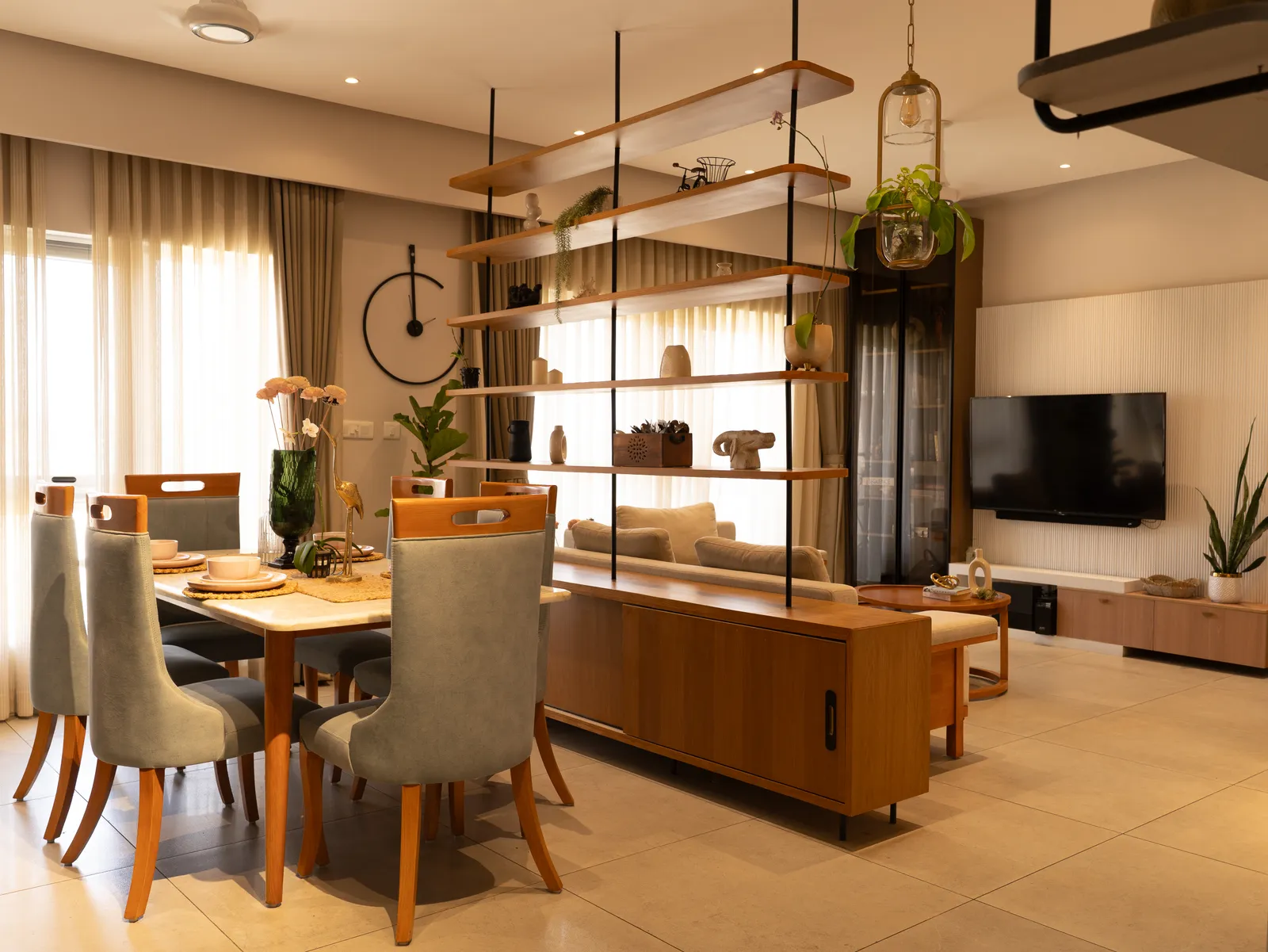 Dining area with oak sideboard and suspended shelves — Amlan's Residence